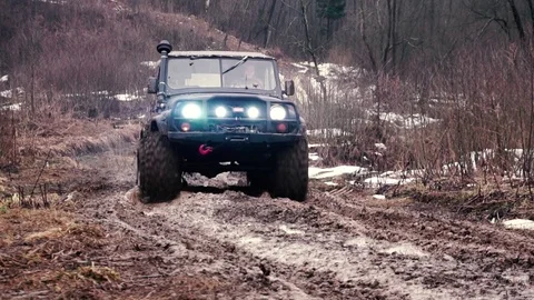 SUV in the mud. Slow motion Stock Footage 74537527