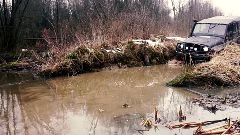 SUV in the mud. Slow motion Stock Footage 74537528