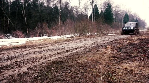 SUV in the mud. Slow motion Stock Footage 74537540