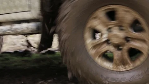 SUV overcome difficult dirty section offroad in 4x4 expedition Stock Footage 75846755