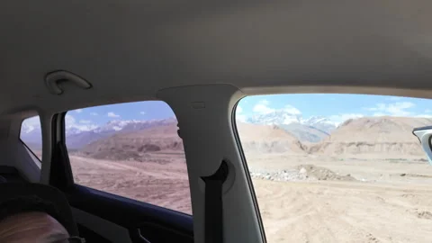 A SUV Parked Alone in the Vast Gobi Desert in Xinjiang, China Stock Footage 339620954