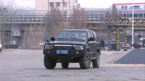 SUV parked on the roadside Stock Footage 253773244