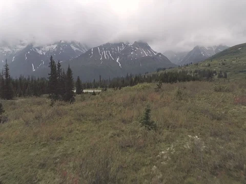SUV Passes by on Mountain Tundra Road Aerial Stock Footage