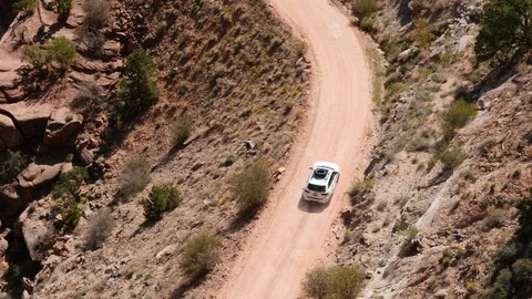 SUV by a path at Canyonlands. Two shots. Stock Footage 93550747