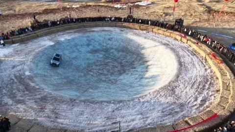 SUV Performance Demonstration in Giant Ice Bowl with Crowd Stock-Footage 331687796
