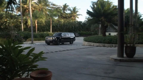 SUV pulls up to Caribbean resort Stock Footage 113392234
