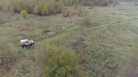 SUV rides on the field Stock Footage 101662652