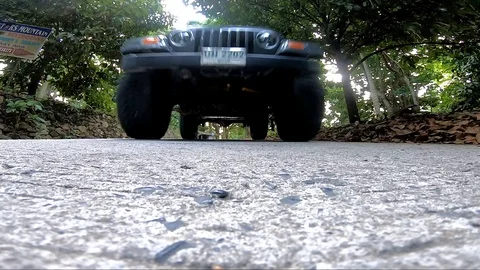 SUV rides over the camera Stock Footage 112786935