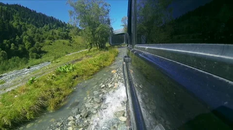 Suv rides on a river Stock Footage 68371543