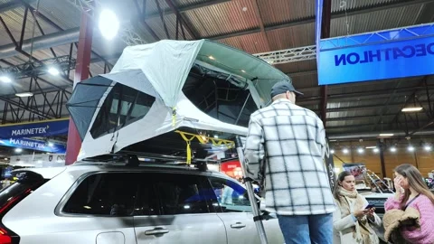 SUV Rooftop Tent Display At Riga Outdoor Adventure And Camping Expo Hall 2025 EU Stock Footage 336641672