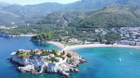 Sveti Stefan beach island back side aerial view - Montenegro Stock Footage 252156026