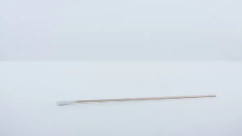 A swab for coronavirus testing on white surface. Stock Footage 130383836