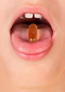 Swallowing the tablet Stock Photos
