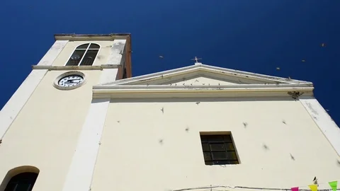 Swallows settle on the church Stock Footage 82962152