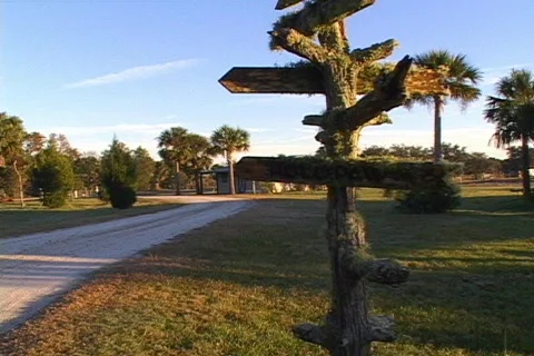 Swamp Buggy Driving by a Sign Post Stock Footage 142503