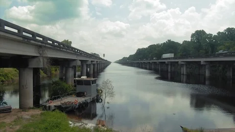 Swamp river and Interstate 10 Freeway. New Orleans, Louisiana, USA Stock Footage 125533842