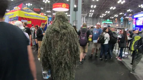 Swamp thing walking through convention floor Video stock 148517909