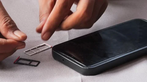 Swapping sim card Stock Footage 336671287
