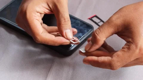 Swapping sim card Video stock 336671307