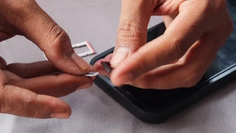 Swapping sim card Stock Footage 336671309