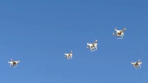 Swarm of Drones flying everywhere in the sky, seamless loop Stock Footage 74297750