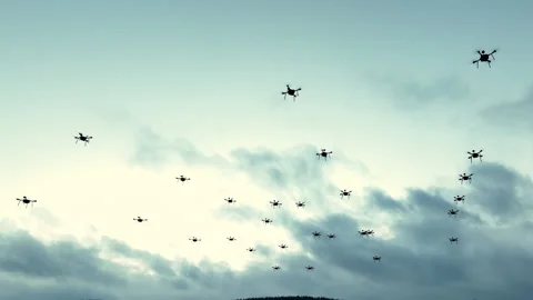 Swarm of drones flying in the sky. Numerous drones flying, a cloudy sky Stock Footage 277130026