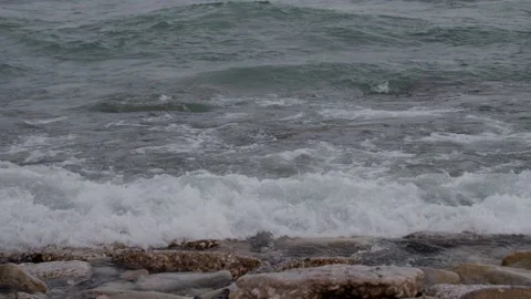 Swash, waves, and rocks in foreground 120fps Lake Michigan at Bradford beach Video stock 166328503