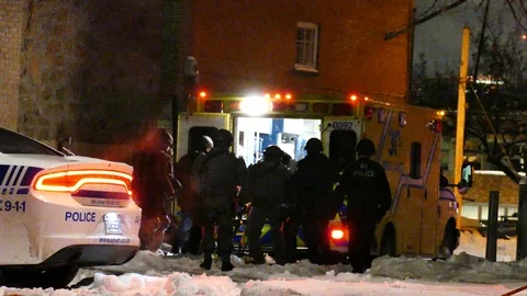 Swat agent loading victim in ambulance Stock Footage 125362970
