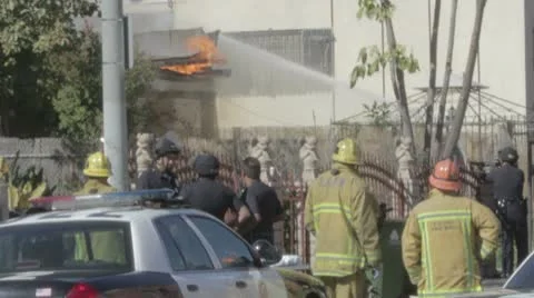 SWAT and Fire situation with guns drawn and flaming roof Stock Footage 10794420