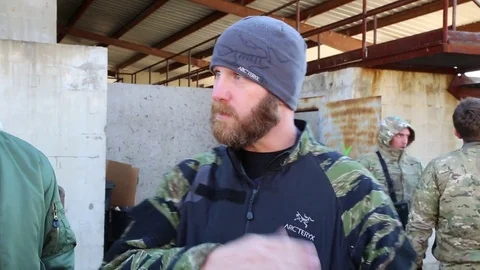 SWAT Instructor Leads Trainees to Open Exericise Stock Footage 70561276