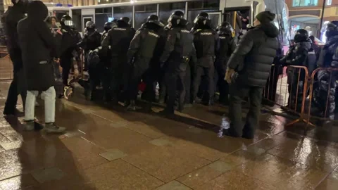SWAT officers cops take the detained persons to the prison truck, Russia Feb 25 Stock Footage 170976134