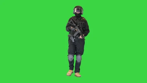 Swat operator with assault rifle walking on a Green Screen, Chroma Key. Stock-Footage 149020053