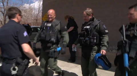 Swat Team being pat down before entering building Stock Footage 31993300