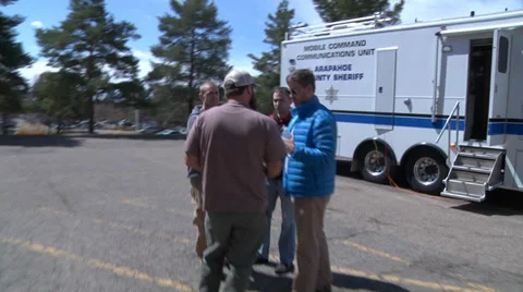 Swat Team Planning outside Mobile Comand Stock Footage 31992294