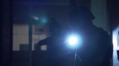 SWAT team walking on corridor during tactical mission Stock Footage 110713546