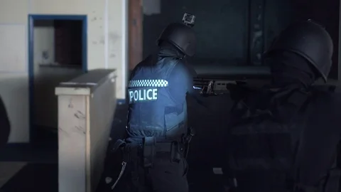 SWAT team walking inside the building during tactical mission 库存影片 110713381