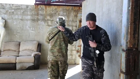 SWAT Trainee Leads Armed Student Backwards in Room Stock Footage 70561441