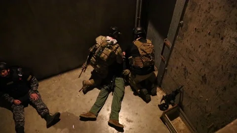 SWAT Trainees Exercise Removal of Wounded Member Stock Footage 70562428
