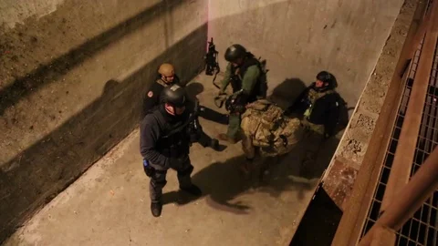 SWAT Trainees Prepare Wounded Member in Training Exercise Stock Footage 70562786