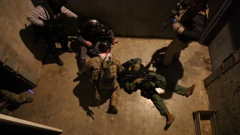SWAT Trainees Train in Removal of Wounded Member Stock Footage 70562451