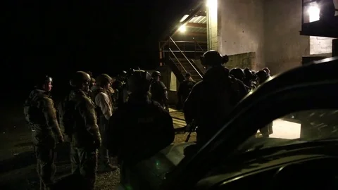 SWAT Trainees Wait Outside Building for Training Exercise Stock Footage 70562679