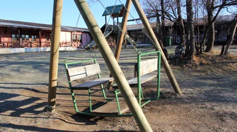 Swaying empty swing in a park. Stock Footage 34989985