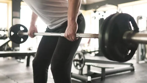 Sweat and Determination Guy Pushing Limits in Barbell Training Stock Footage 278387914