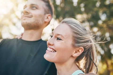 Sweat, smile and repeat. a young couple smiling together outdoors. Stock Photos