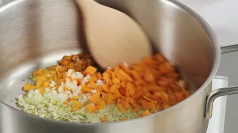 Sweating finely chopped vegetables in a pan Stock Footage 24667092