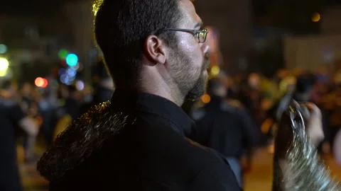 Sweaty man with glasses beating himself during Muharram, Iran, 4K, DNxHR Stock Footage 150166735