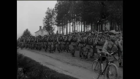 SWEDEN - 1910s - Conscripted infantry men carry their belongings and bayonets as Stock Footage 322761797