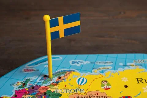 Sweden flag pin placed on a map of Europe Stock Photos