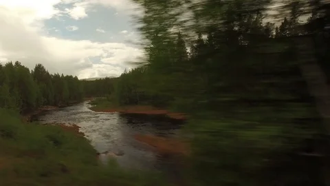 Sweden forest and river seen from a driving vehicle, Tackasen Video stock 103690987
