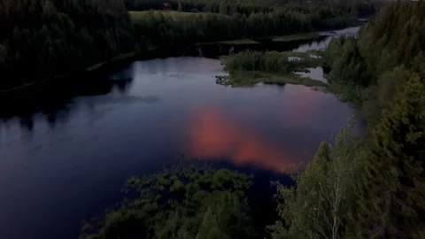Sweden forrest lake with reflection og midnight sun Stock Footage 86817861
